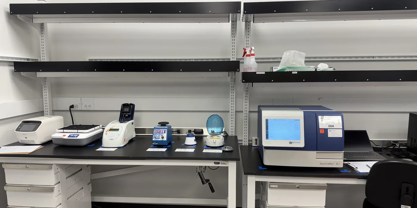 Twenty Seven Labs instrumentation bench in Hayward, California, with plate readers and assay development equipment